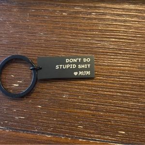 black keychain “don’t do stupid sh!t <3 mom”